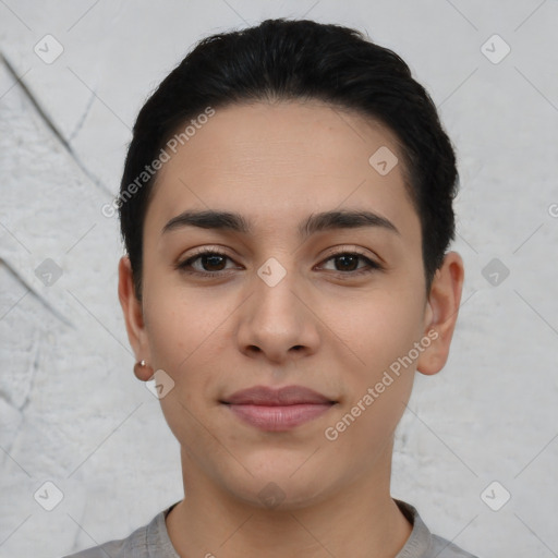 Joyful latino young-adult female with short  black hair and brown eyes