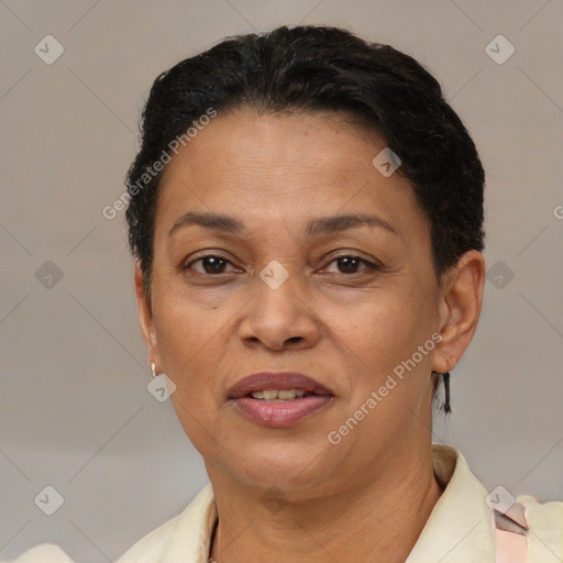 Joyful latino adult female with short  brown hair and brown eyes