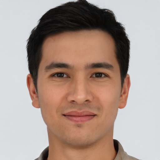 Joyful asian young-adult male with short  black hair and brown eyes