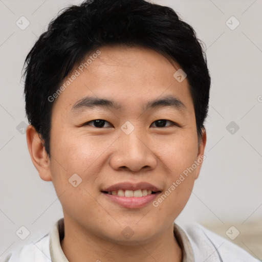 Joyful asian young-adult male with short  brown hair and brown eyes