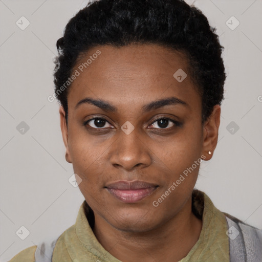 Joyful black young-adult female with short  black hair and brown eyes