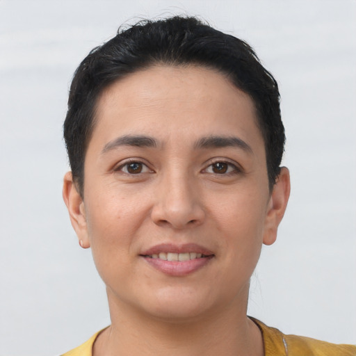 Joyful latino young-adult female with short  brown hair and brown eyes