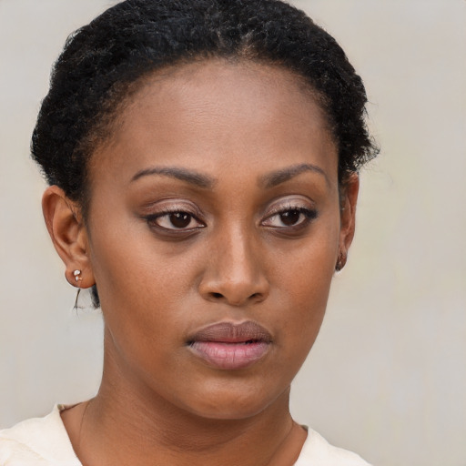 Neutral black young-adult female with short  brown hair and brown eyes