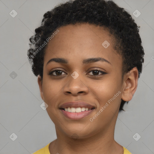 Joyful black young-adult female with short  black hair and brown eyes