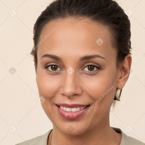 Joyful white young-adult female with short  brown hair and brown eyes