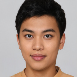 Joyful asian young-adult male with short  black hair and brown eyes