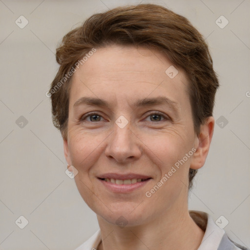 Joyful white adult female with short  brown hair and grey eyes