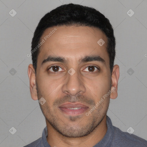 Joyful latino young-adult male with short  black hair and brown eyes