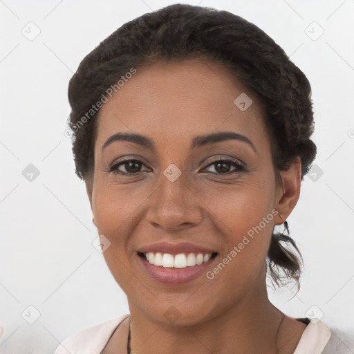 Joyful latino young-adult female with short  brown hair and brown eyes