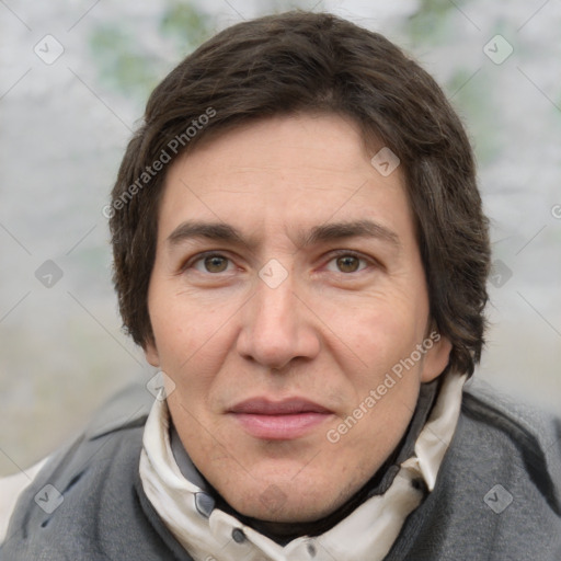 Joyful white adult male with short  brown hair and grey eyes