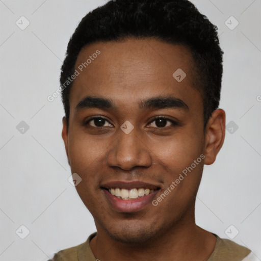 Joyful black young-adult male with short  black hair and brown eyes