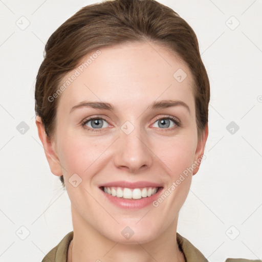 Joyful white young-adult female with long  brown hair and grey eyes