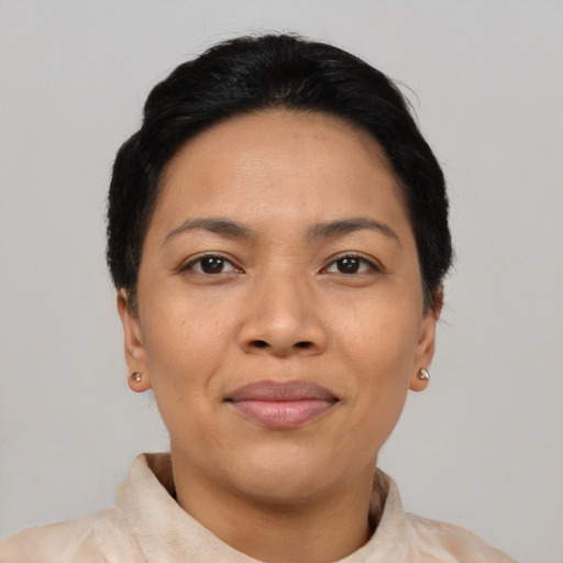 Joyful asian young-adult female with short  black hair and brown eyes
