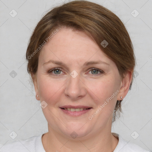 Joyful white adult female with medium  brown hair and grey eyes