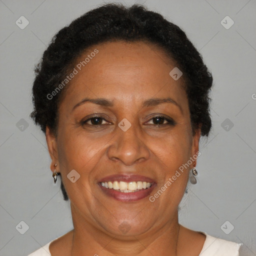 Joyful black adult female with short  brown hair and brown eyes