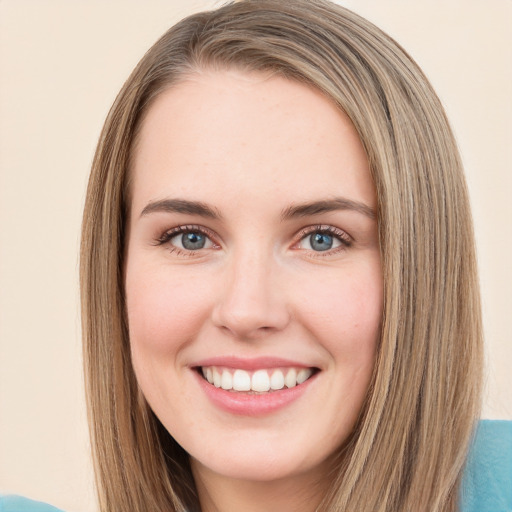 Joyful white young-adult female with long  brown hair and green eyes