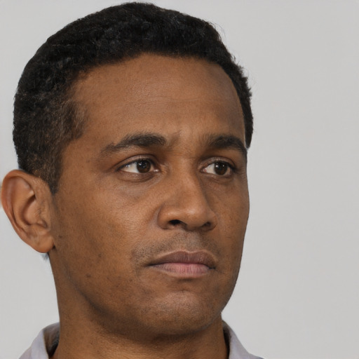 Neutral black young-adult male with short  brown hair and brown eyes