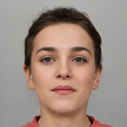 Neutral white young-adult female with short  brown hair and brown eyes