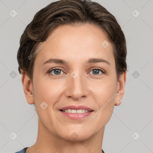 Joyful white young-adult female with short  brown hair and grey eyes