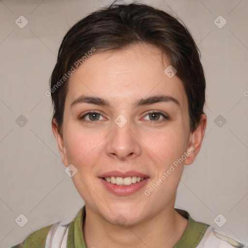 Joyful white young-adult female with short  brown hair and grey eyes