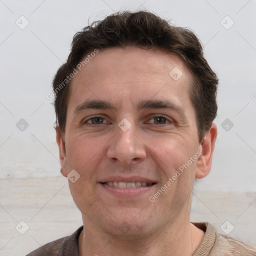 Joyful white adult male with short  brown hair and brown eyes