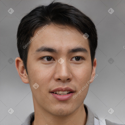 Joyful asian young-adult male with short  brown hair and brown eyes