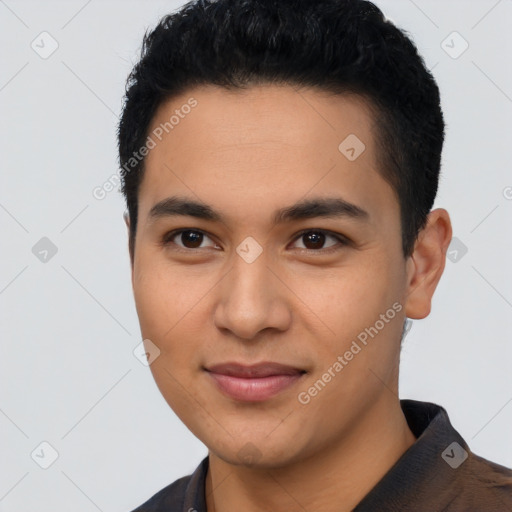 Joyful latino young-adult male with short  black hair and brown eyes