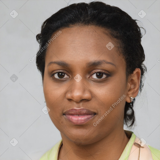 Joyful black young-adult female with medium  black hair and brown eyes