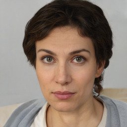 Neutral white young-adult female with short  brown hair and brown eyes