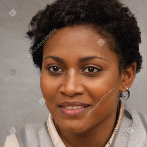 Joyful black young-adult female with short  brown hair and brown eyes