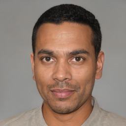 Neutral latino adult male with short  black hair and brown eyes