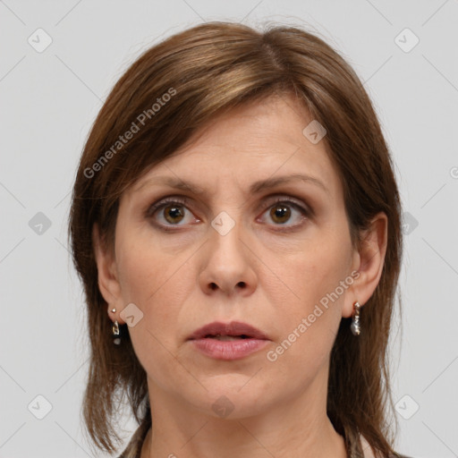 Joyful white adult female with medium  brown hair and grey eyes