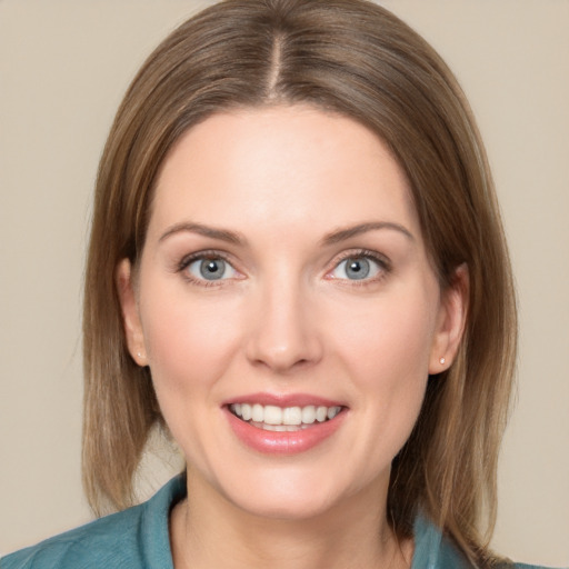 Joyful white young-adult female with medium  brown hair and blue eyes