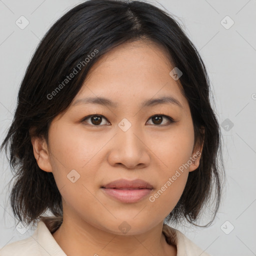 Joyful asian young-adult female with medium  brown hair and brown eyes