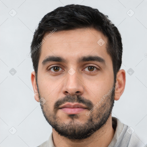 Neutral latino young-adult male with short  black hair and brown eyes