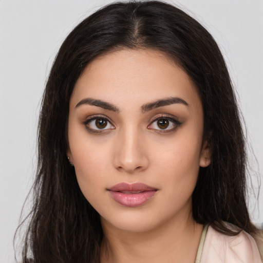 Neutral latino young-adult female with long  brown hair and brown eyes