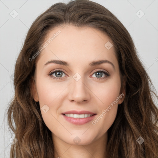 Joyful white young-adult female with long  brown hair and green eyes