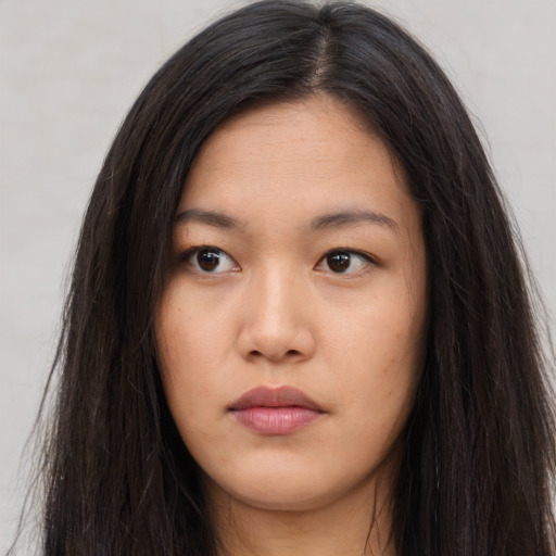 Neutral asian young-adult female with long  brown hair and brown eyes