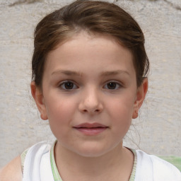 Joyful white child female with short  brown hair and brown eyes