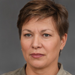 Joyful white adult female with short  brown hair and grey eyes