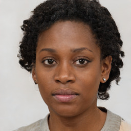 Neutral black young-adult female with short  brown hair and brown eyes