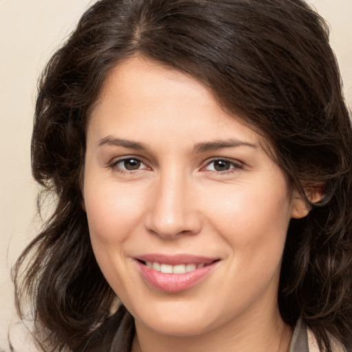 Joyful white young-adult female with medium  brown hair and brown eyes