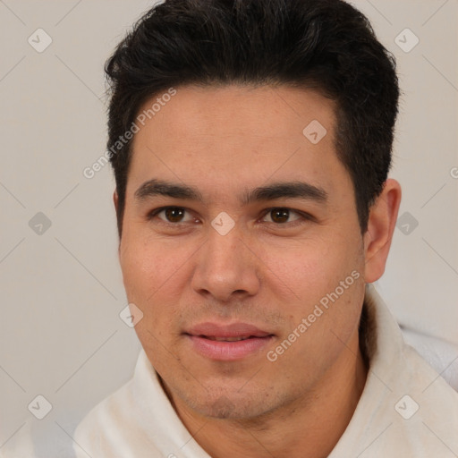 Joyful latino young-adult male with short  brown hair and brown eyes