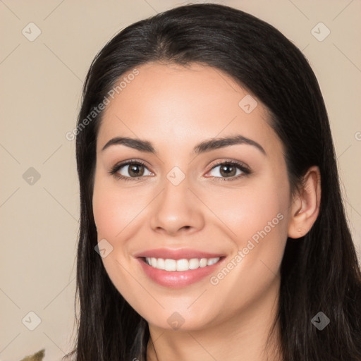 Joyful white young-adult female with long  black hair and brown eyes