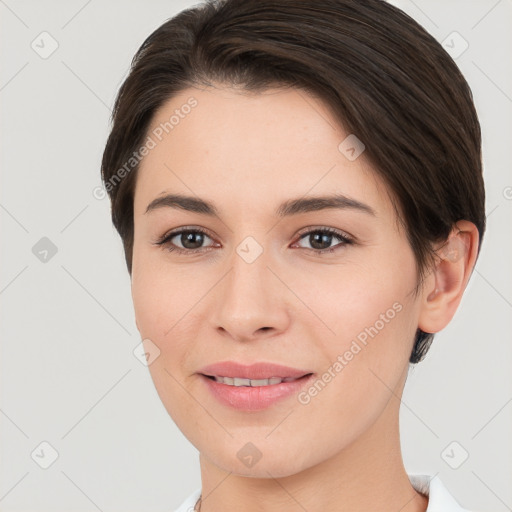 Joyful white young-adult female with short  brown hair and brown eyes