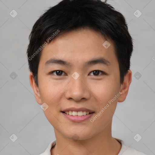 Joyful asian young-adult male with short  brown hair and brown eyes