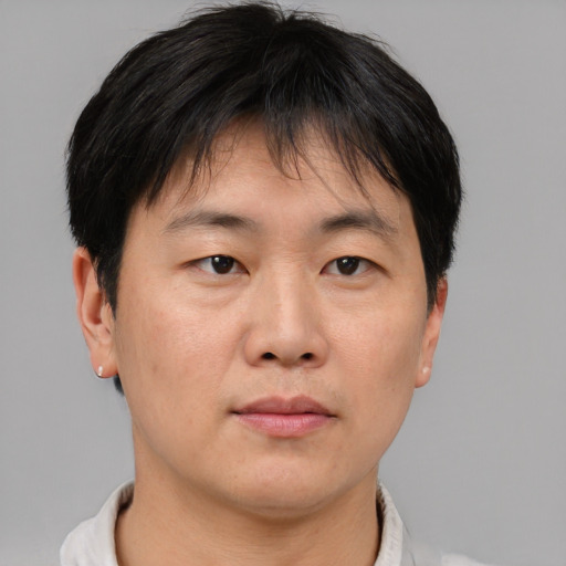 Neutral asian adult male with short  brown hair and brown eyes