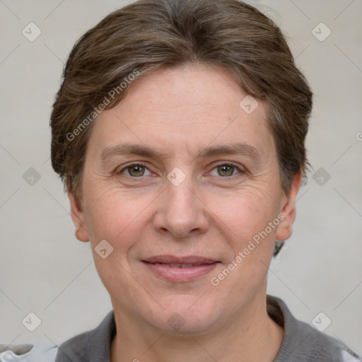 Joyful white adult female with short  brown hair and grey eyes