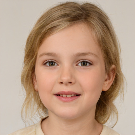 Joyful white child female with medium  brown hair and brown eyes