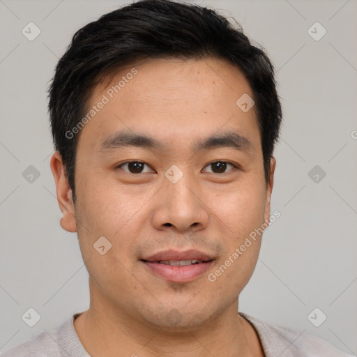 Joyful white young-adult male with short  black hair and brown eyes